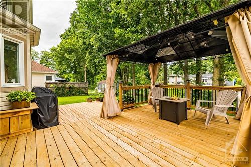 The 8 mature oak trees in the back provide shade, privacy, and natural beauty. - 24 Mary Hill Crescent, Richmond, ON - Outdoor With Deck Patio Veranda With Exterior
