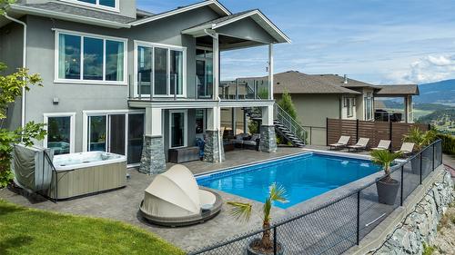 593 Harrogate Lane, Kelowna, BC - Outdoor With In Ground Pool With Deck Patio Veranda