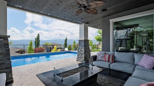 593 Harrogate Lane, Kelowna, BC - Outdoor With In Ground Pool With Deck Patio Veranda