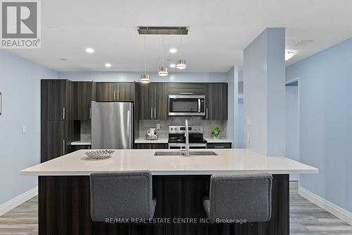 104 - 4205 Shipp Dr Drive, Mississauga, ON - Indoor Photo Showing Kitchen With Stainless Steel Kitchen With Double Sink With Upgraded Kitchen