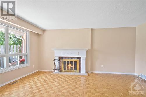 Living room with wood fireplace - 137 Mcclellan Road, Ottawa, ON - Indoor With Fireplace