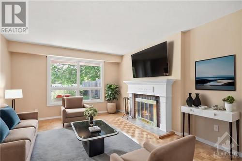 Staged living room - 137 Mcclellan Road, Ottawa, ON - Indoor Photo Showing Living Room With Fireplace