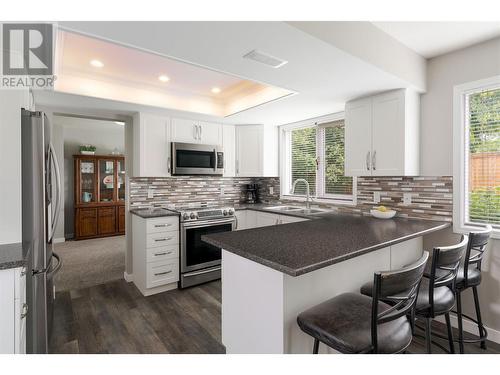 1180 Wintergreen Crescent, Kelowna, BC - Indoor Photo Showing Kitchen With Stainless Steel Kitchen With Double Sink With Upgraded Kitchen