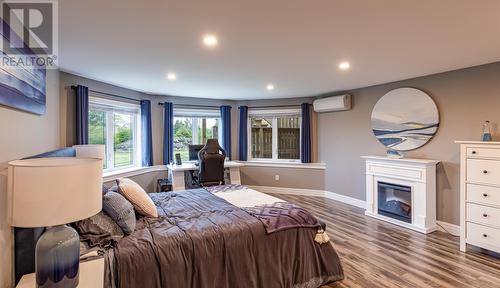 2 Mountain View Drive, Holyrood, NL - Indoor Photo Showing Bedroom With Fireplace