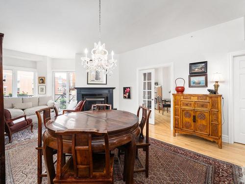 Dining room - 205-285 Av. Laurier E., Montréal (Le Plateau-Mont-Royal), QC - Indoor Photo Showing Dining Room With Fireplace