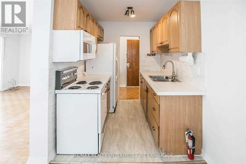 54 Rabbit Lane, Toronto (Eringate-Centennial-West Deane), ON - Indoor Photo Showing Kitchen With Double Sink