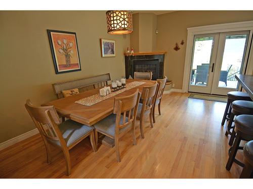 2864 Lower Six Mile Road, Nelson, BC - Indoor Photo Showing Dining Room With Fireplace