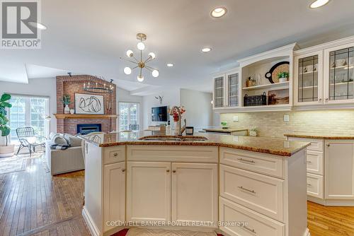 6977 Lambeth Walk, London, ON - Indoor Photo Showing Kitchen With Fireplace With Double Sink