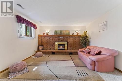 1124 Coachwood, Lasalle, ON - Indoor Photo Showing Living Room With Fireplace