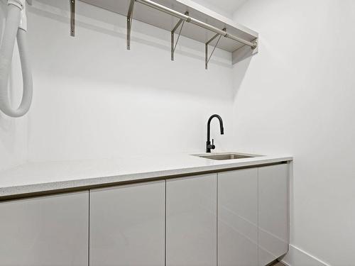 Salle de lavage - 48 Rue Lookout, Morin-Heights, QC - Indoor With Storage