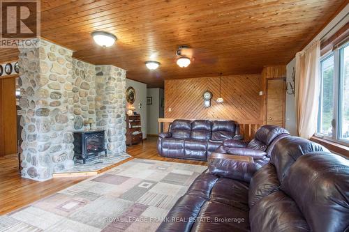 497 Mooney Road, Hastings Highlands, ON - Indoor Photo Showing Living Room With Fireplace