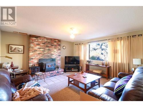 1532 Carmi Avenue, Penticton, BC - Indoor Photo Showing Living Room With Fireplace