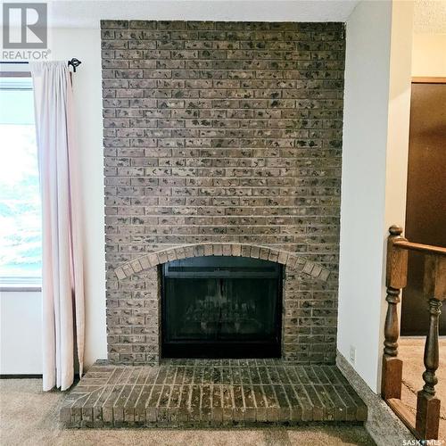 515 Grant Bay, Esterhazy, SK - Indoor Photo Showing Living Room With Fireplace