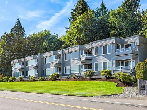 102-3132 Island Hwy West, Qualicum Beach, BC - Outdoor With Balcony With Facade