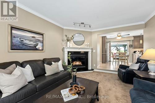263 Pigeon Creek Road, Kawartha Lakes, ON - Indoor Photo Showing Living Room With Fireplace
