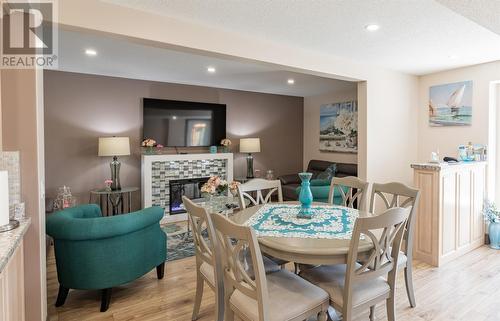 14 Church Road, Pilley'S Island, NL - Indoor Photo Showing Dining Room With Fireplace