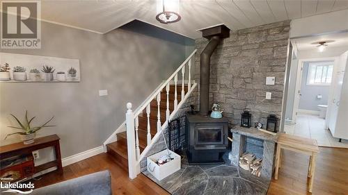 Stairwell - 639 Ravenscliffe Road, Huntsville, ON - Indoor Photo Showing Other Room With Fireplace