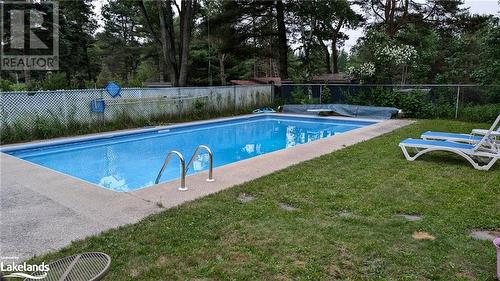 In Ground Fenced Pool - 639 Ravenscliffe Road, Huntsville, ON - Outdoor With In Ground Pool With Backyard