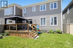 Fully fenced rear yard is great for the kids and Fido to play. - 
