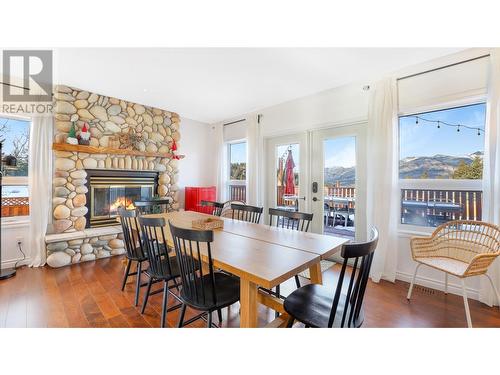 945 Westridge  Way, Invermere, BC - Indoor Photo Showing Dining Room With Fireplace