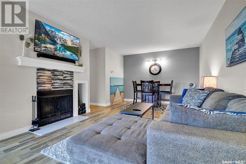 107 15 Alport Crescent, Regina, SK - Indoor Photo Showing Living Room With Fireplace