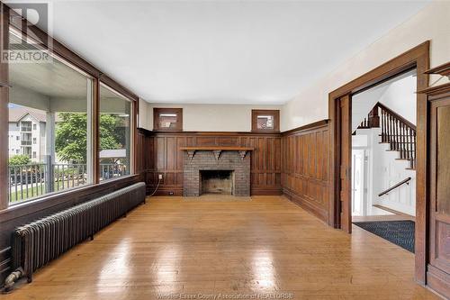 3026 Sandwich, Windsor, ON - Indoor Photo Showing Other Room With Fireplace