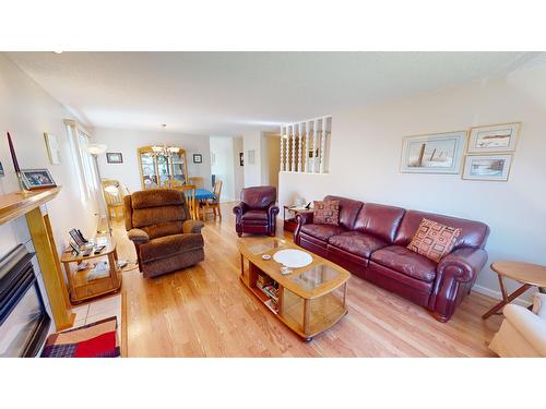 2209 5Th Street S, Cranbrook, BC - Indoor Photo Showing Living Room With Fireplace