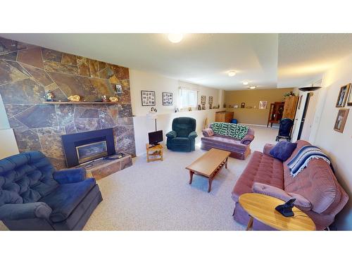 2209 5Th Street S, Cranbrook, BC - Indoor Photo Showing Living Room With Fireplace