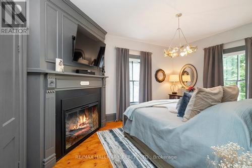 33 Beech Avenue, Clarington, ON - Indoor Photo Showing Bedroom With Fireplace