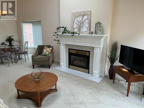 14 - 6 Piazza Verde, New Tecumseth, ON - Indoor Photo Showing Living Room With Fireplace