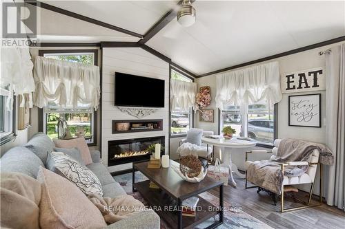 246 - 8845 Lundy'S Lane, Niagara Falls, ON - Indoor Photo Showing Living Room With Fireplace