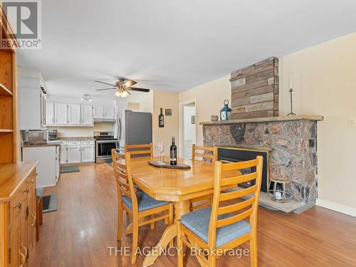 155 Balsam Chutes W, Huntsville, ON - Indoor Photo Showing Dining Room With Fireplace