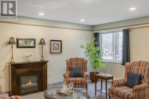 211 - 111 Grew Boulevard, Georgina, ON - Indoor Photo Showing Other Room With Fireplace