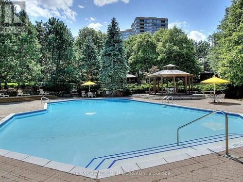 330 - 25 Bamburgh Circle, Toronto, ON - Outdoor With In Ground Pool With Backyard