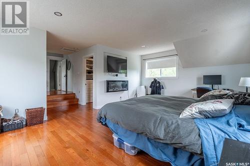 Winds Edge Farm, Corman Park Rm No. 344, SK - Indoor Photo Showing Bedroom With Fireplace