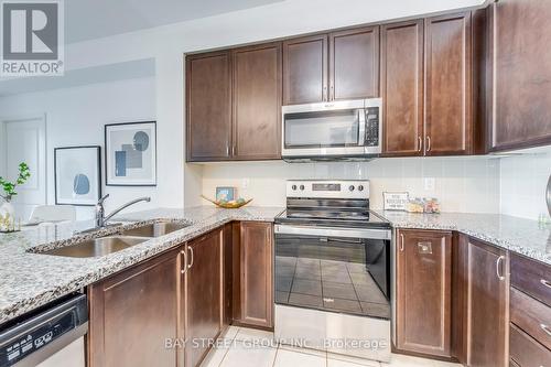 203 - 349 Rathburn Road W, Mississauga, ON - Indoor Photo Showing Kitchen With Stainless Steel Kitchen With Double Sink With Upgraded Kitchen