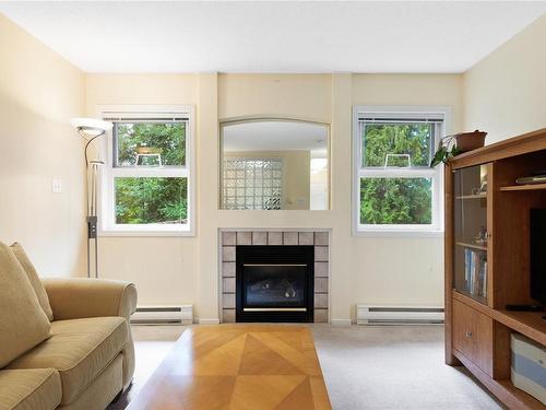 203-440 Schley Pl, Qualicum Beach, BC - Indoor Photo Showing Living Room With Fireplace