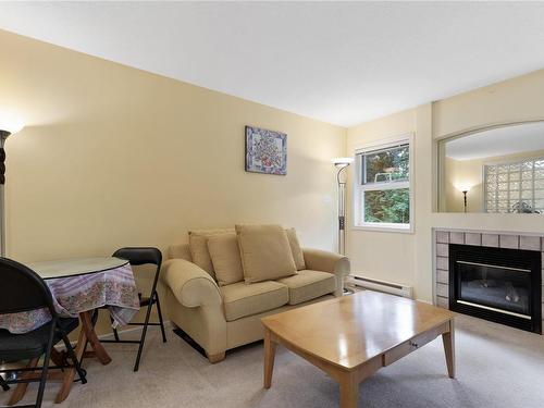 203-440 Schley Pl, Qualicum Beach, BC - Indoor Photo Showing Living Room With Fireplace