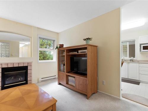 203-440 Schley Pl, Qualicum Beach, BC - Indoor Photo Showing Living Room With Fireplace