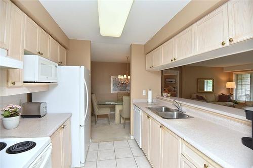 216 Plains Road W|Unit #C205, Burlington, ON - Indoor Photo Showing Kitchen With Double Sink