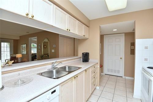 216 Plains Road W|Unit #C205, Burlington, ON - Indoor Photo Showing Kitchen With Double Sink