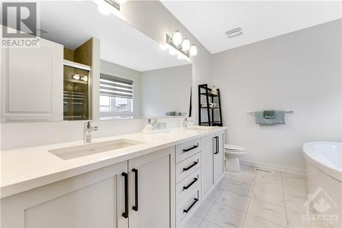 Top level vanity countertops with 5-piece ensuite - 772 Cappamore Drive, Ottawa, ON - Indoor Photo Showing Bathroom