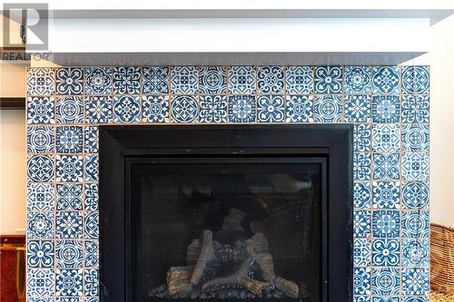 Unique Tiles from Euro Tile - 772 Cappamore Drive, Ottawa, ON - Indoor Photo Showing Living Room With Fireplace