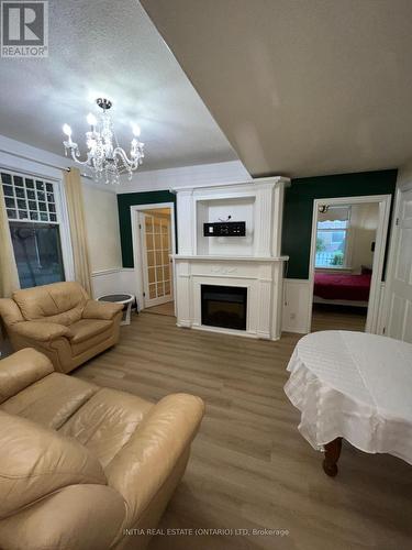 Main Floor Living Room - 552 Adelaide Street N, London, ON - Indoor Photo Showing Other Room With Fireplace