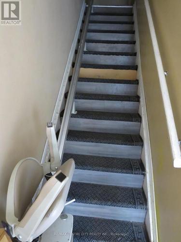 STAIRS TO SECOND FLOOR WITH CHAIR LIFT - 27 - 490 Third Street, London, ON - Indoor Photo Showing Other Room