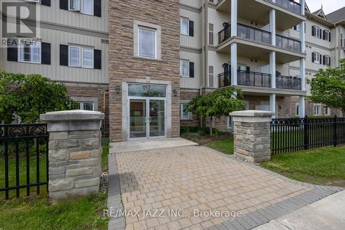 202 - 1 Sidney Lane, Clarington, ON - Outdoor With Balcony With Facade