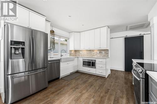 951 13Th Avenue Nw, Moose Jaw, SK - Indoor Photo Showing Kitchen With Stainless Steel Kitchen With Upgraded Kitchen