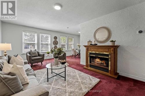 20 Deerpark Crescent, Clarington, ON - Indoor Photo Showing Living Room With Fireplace