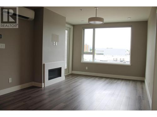 303 1087 6Th Avenue, Prince George, BC - Indoor With Fireplace