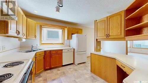 29 Kensington Lane, Regina, SK - Indoor Photo Showing Kitchen With Double Sink